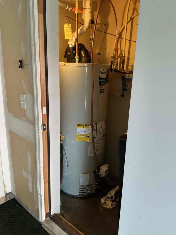 Responded to service call for toilet malfunction. Upon inspection, identified faulty flapper causing continuous running and cycling. Replaced deteriorated flapper with new component. Post-installation testing revealed toilet continues to slowly drain and refill approximately every 30 minutes, indicating additional underlying issue requiring further diagnosis. Documented existing Kohler toilet tank components and overall plumbing system configuration including water heater installation for reference.