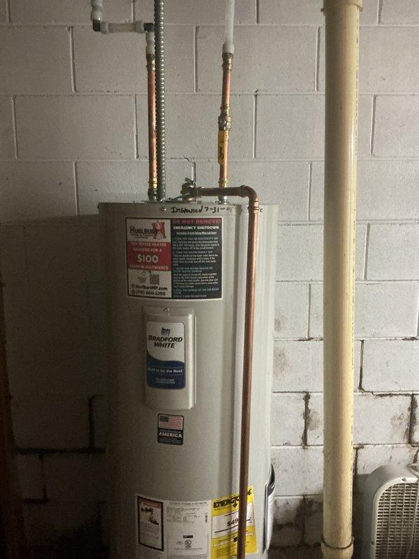 Replaced a failed 50-gallon electric water heater that was experiencing severe corrosion at the base of the tank. Removed the existing deteriorated unit and installed a new Bradford White electric water heater in the basement utility area. Connected copper supply lines to the inlet and outlet ports at the top of the tank, ensuring proper hot and cold water flow. Installed appropriate temperature and pressure relief valve with discharge piping. Verified all electrical connections were secure and compliant with code requirements. Tested the new unit for proper operation and confirmed no leaks at any connection points.