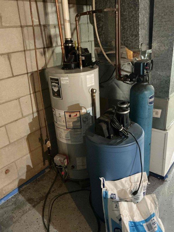 Responded to furnace inspection request following home inspector's observation of black exhaust. Upon activation, identified major flame rollout on one burner while two remaining burners operated normally. Conducted camera inspection of heat exchanger, which revealed a crack at the heat exchanger inlet causing abnormal combustion patterns and excessive soot buildup when blower motor engaged. Documented findings with photographs and reviewed condition with homeowner. Applied red danger lockout tag to unit due to cracked heat exchanger presenting safety hazard. Unit tagged out of service pending replacement options for either complete furnace system or heat exchanger component.