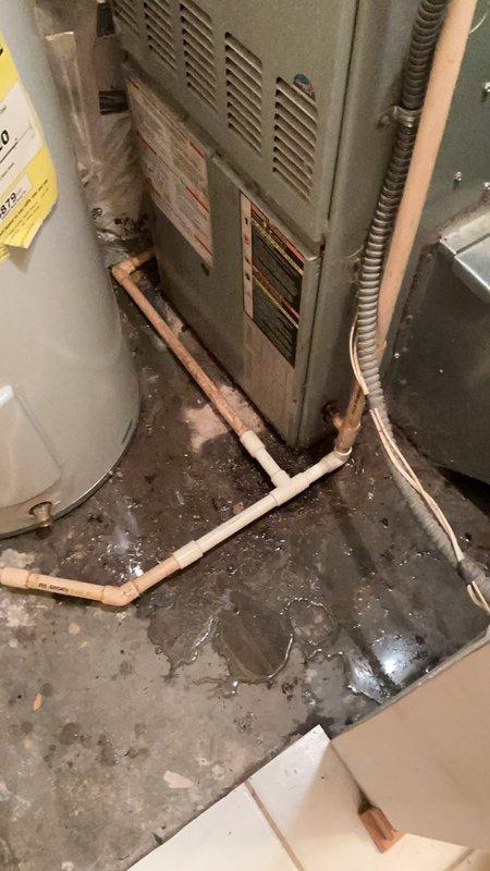 Responded to water leak in mechanical room originally identified by HVAC technician. Upon inspection, discovered broken CPVC condensate drain line connected to furnace and air handler unit. The damaged section had separated, causing water discharge onto concrete floor. Removed failed CPVC pipe section and installed new replacement piping to restore proper condensate drainage from HVAC equipment. Tested system operation to verify leak was eliminated and drainage functioning correctly.