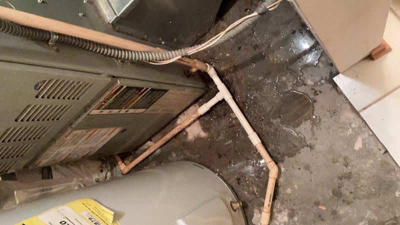 Responded to water leak in mechanical room originally identified by HVAC technician. Upon inspection, discovered broken CPVC condensate drain line connected to furnace and air handler unit. The damaged section had separated, causing water discharge onto concrete floor. Removed failed CPVC pipe section and installed new replacement piping to restore proper condensate drainage from HVAC equipment. Tested system operation to verify leak was eliminated and drainage functioning correctly.