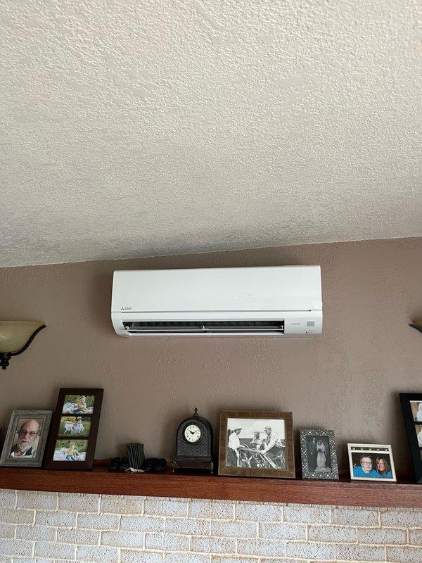 Responded to service call for 5-year-old Mitsubishi single-head mini-split system not maintaining temperature during hot weather. Upon arrival, performed comprehensive inspection of both indoor and outdoor units. Outdoor unit inspected and cleaned, with all routine components found to be functioning properly. Indoor head unit inspection revealed significant dirt accumulation on internal components, including debris beginning to collect on blower wheel, despite customer having recently cleaned filters. Verified condensate drain line was clear and flowing properly. System found to be operational but performance compromised by contaminated indoor coil and blower assembly. Recommended professional deep cleaning service for indoor head unit to restore optimal cooling efficiency and airflow. Customer requested coordination with home warranty provider before proceeding with additional cleaning services.
