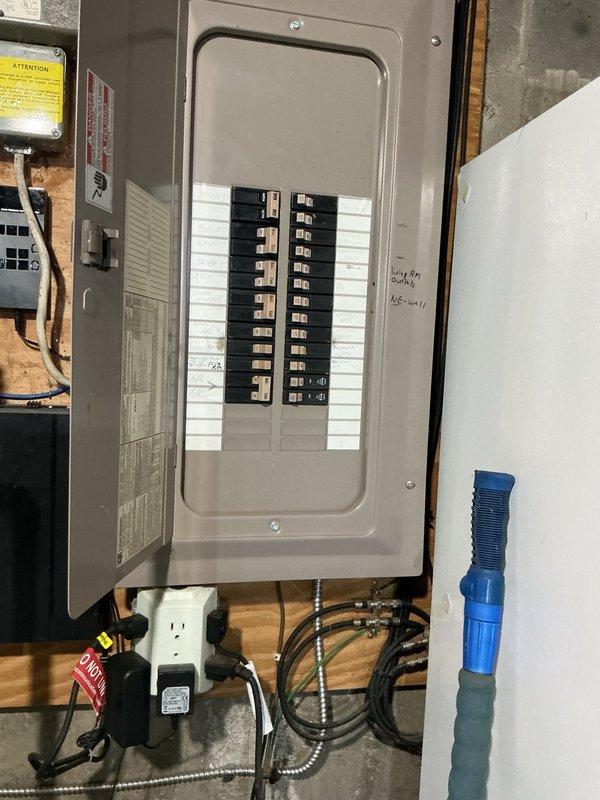 Replaced existing electric water heater with new 50-gallon Richmond brand unit in residential basement location. Drained and removed old water heater, then installed replacement unit using basic installation materials including pipe connections, insulation wrapping, and securing straps. Connected unit to existing electrical service and plumbing lines, verified proper amperage draw to confirm heating element operation, and tested system functionality to ensure proper performance. Installation completed with all applicable safety labels and energy guide information visible, and permit obtained per local code requirements.