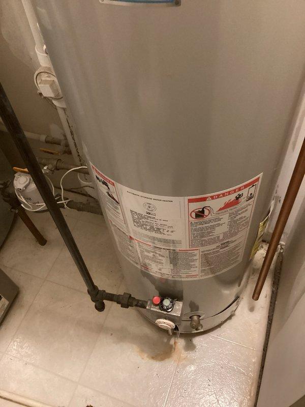 Responded to multiple plumbing issues including non-functional garbage disposal, upstairs toilet problems, refrigerator water line malfunction, and water heater pilot light failure. Removed and replaced seized garbage disposal unit with new Badger 5 model to restore kitchen sink drainage. Diagnosed upstairs toilet with multiple component failures including broken handle, deteriorated tank-to-bowl gasket, faulty flapper valve, and outdated float-style fill valve causing constant running; provided estimate for complete toilet replacement. Cut open wall to access defective refrigerator feed line shutoff valve that was stuck open and continuously running; removed old valve and box, installed new PEX step fitting with new tubing to restore proper water line control. Relit water heater pilot light and verified unit returned to normal operation, restoring hot water supply to residence.