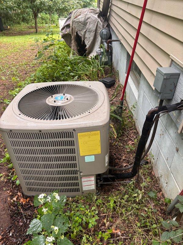 Responded to no cooling complaint on 12-year-old residential air conditioning system experiencing repeated freeze-up conditions. Upon arrival, performed comprehensive diagnostic evaluation of both indoor and outdoor equipment. Verified air filter was clean and evaporator coil showed no signs of blockage or contamination. Confirmed blower assembly operating properly with adequate airflow throughout the system. Conducted thorough inspection of outdoor condensing unit, verifying compressor, condenser fan motor, and electrical components functioning as designed. Performed refrigerant charge assessment and identified system critically low on R-410A refrigerant, indicating active leak in the system. Provided detailed explanation of findings and presented repair options to address the refrigerant leak. Customer declined repairs and opted to pursue replacement equipment through alternative provider.