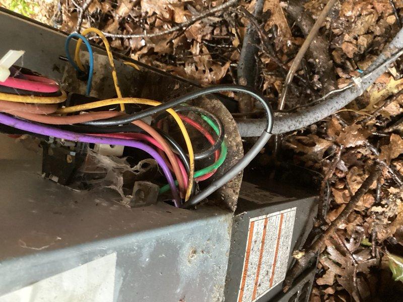 Responded to no-cooling complaint on 15-year-old air conditioning system. Found indoor blower operational but outdoor unit not running. Upon inspection of condenser unit, discovered rodent-damaged wiring with multiple compromised conductors. Electrical connections showed significant debris accumulation and environmental exposure. Repaired damaged wiring harness, replaced affected wire sections, and restored proper electrical connections to outdoor unit. Cycled system through complete operation, verified condenser startup and function. Checked refrigerant charge and confirmed system parameters within normal operating range. Unit restored to full cooling operation.