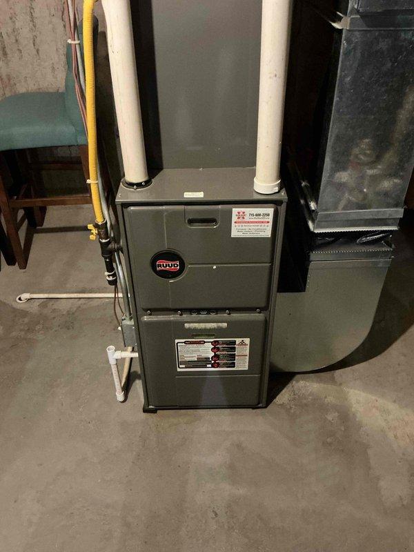 Performed comprehensive air conditioning tune-up on residential Ruud HVAC system with no reported issues. Cleaned outdoor condenser unit and indoor components, inspected all electrical connections and controls, and verified proper refrigerant pressures and temperatures using digital manifold gauges. System tested and confirmed cooling effectively with superheat reading of 33°F and subcooling of 17°F, indicating optimal refrigerant charge and airflow.