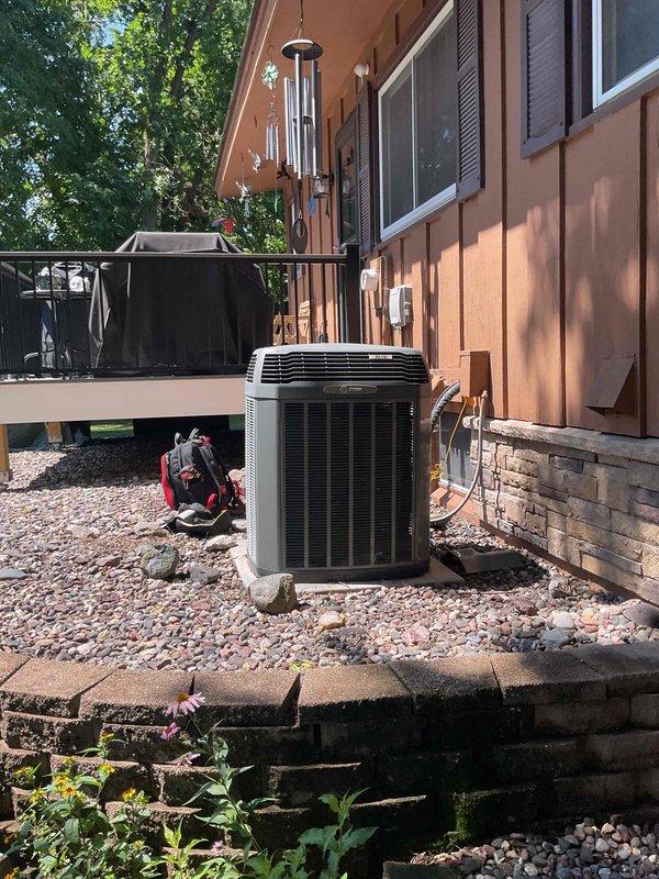 Responded to no cooling complaint on 22-year-old air conditioning system. Upon arrival, performed comprehensive system evaluation including temperature differential testing at supply registers and visual inspection of outdoor condensing unit. Customer reported discharge air temperature of approximately 55°F at closest supply vent, noting previous performance in the low 40s range. Conducted full AC tune-up and maintenance protocol, inspecting all major components including condenser coils, refrigerant levels, electrical connections, and airflow. Customer confirmed recent filter replacement within the past year. After thorough diagnostic testing and system evaluation, determined unit was operating within acceptable parameters with no mechanical deficiencies identified. System currently functioning properly with no cooling issues present at time of service.