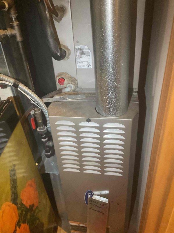 Responded to no cooling complaint on residential HVAC system over 10 years old. Upon arrival, found thermostat set to 86 degrees and confirmed inadequate cooling performance. Performed comprehensive system evaluation as a second opinion following previous minor repair by another service provider. Inspected furnace, air handler, condensate lines, refrigerant connections, and associated ductwork in mechanical closet. Observed moisture accumulation on supply ductwork indicating potential airflow or insulation concerns. Verified all electrical connections, gas lines, and copper refrigerant piping for proper installation and condition. Documented existing equipment configuration including furnace unit, water heater, expansion tank, and ventilation components. Based on age of system, declining performance, and previous repair history, recommended full system replacement as most cost-effective long-term solution. Provided detailed assessment and replacement options to homeowner for considerat