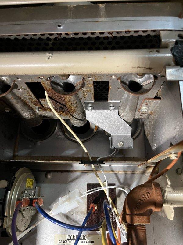 Replaced single-stage control board on heating system, which required custom wire splicing and installation of appropriate wire harnesses to complete the conversion. Original transformer stud was damaged during removal, necessitating use of a larger replacement transformer from stock to ensure proper operation. Installed new igniter assembly with harness as part of the control board kit, tested all system functions, and verified proper heating operation upon completion.