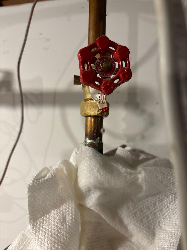 Responded to a leak on the hot water line at the water heater caused by a failed seal on the gate valve. Removed the defective gate valve, installed a new ball valve with proper couplings, restored water service, verified system integrity by checking for additional leaks, and flushed all lines to ensure proper operation.