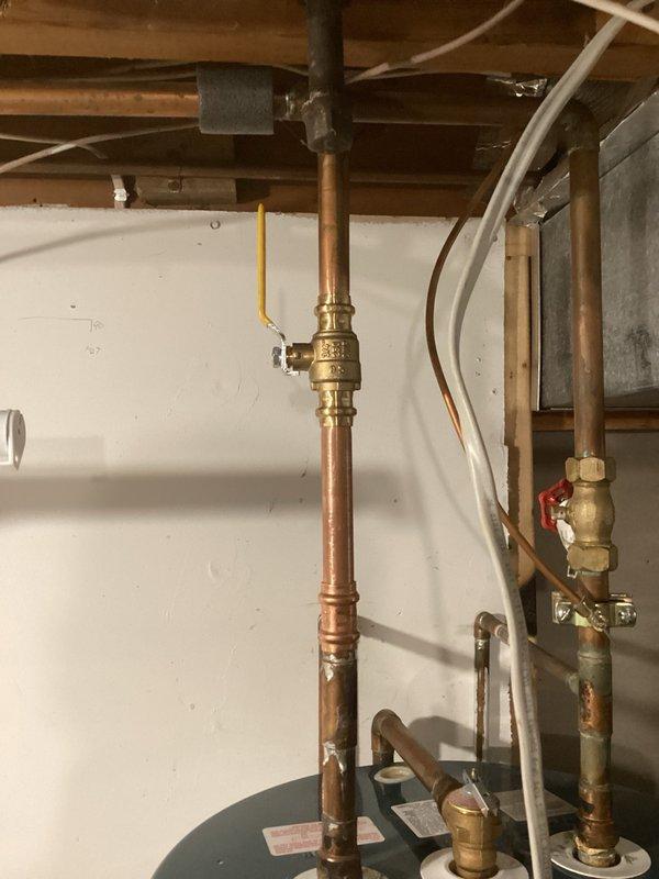 Responded to a leak on the hot water line at the water heater caused by a failed seal on the gate valve. Removed the defective gate valve, installed a new ball valve with proper couplings, restored water service, verified system integrity by checking for additional leaks, and flushed all lines to ensure proper operation.