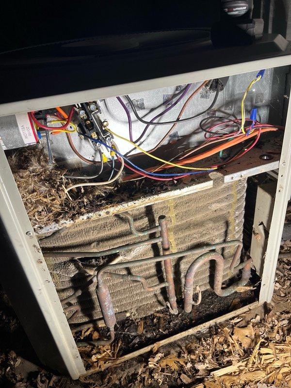 Responded to service call for AC unit not shutting off when commanded at thermostat. Upon arrival, tested system operation and found unit cycling properly with thermostat calls for cooling; intermittent issue could not be replicated during diagnostic testing. Inspected Trane XE 1000 condenser unit and indoor air handler components, noting severely deteriorated evaporator coil with heavy dirt accumulation, biological growth, and corrosion affecting heat exchanger surfaces. Advised customer that intermittent shutdown issue likely thermostat-related but cannot be confirmed without issue recurring. Provided estimate for thermostat replacement for future consideration. System operational at time of departure.