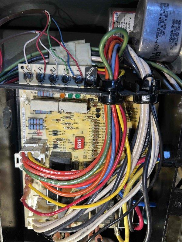Responded to no cooling complaint on 29-year-old R22 system. Diagnosed blower motor failure preventing indoor air circulation. Temporarily wired blower motor to run continuously to restore air movement while researching parts availability and repair options for the aging WeatherKing unit.