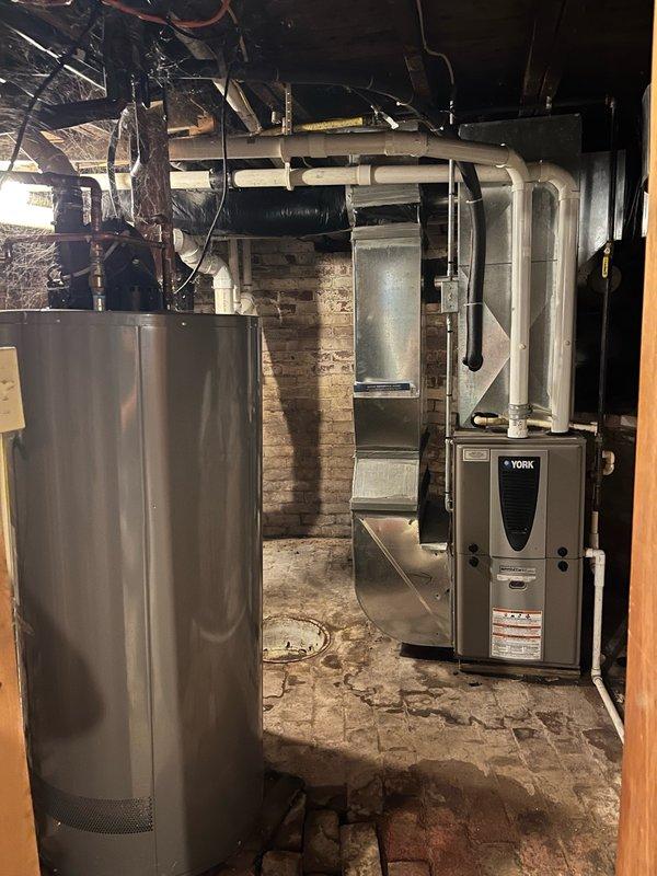 Responded to no cooling complaint on residential split system. Upon arrival, customer reported unit had been frozen up prior to service call and had turned system off with fan on to thaw coil. Confirmed no airflow at supply registers despite thermostat calling for blower operation. 

Inspected York furnace and verified proper voltage supply from control board to blower motor. Performed diagnostic testing with ECM tester to confirm motor failure. Blower motor determined to be defective and non-operational. Observed significant water accumulation throughout furnace cabinet from previous freeze-up event, indicating potential for additional component damage that cannot be fully assessed until airflow is restored.

Given the age of the equipment (10+ years old, installed prior to 2010), overall condition of the unit, visible water damage, and history of previous service issues, recommended obtaining replacement system pricing for comparison against repair costs. Customer acknowledged ECM bl