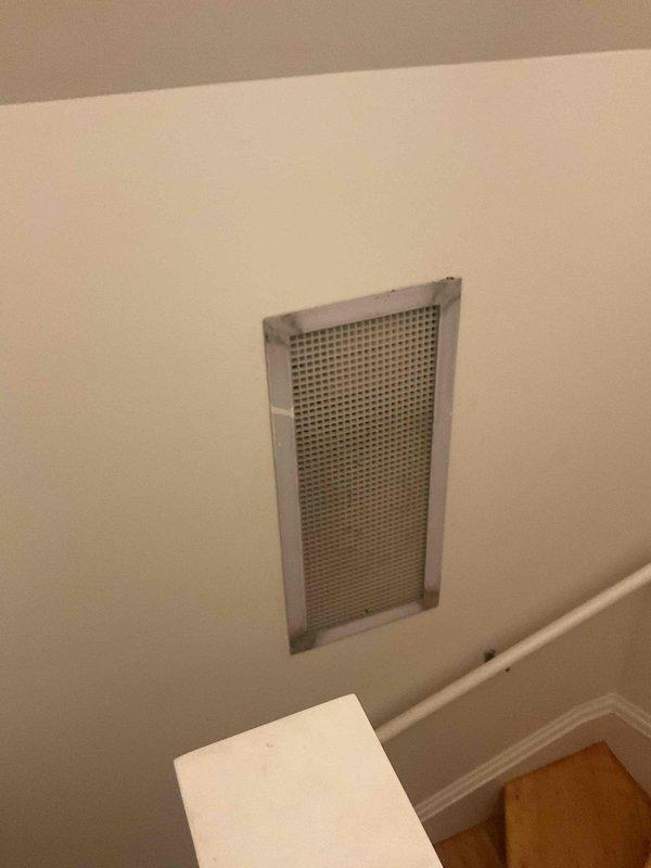 Responded to no cooling complaint on third floor system. Upon arrival, performed diagnostic evaluation and airflow measurements using digital instrumentation at supply registers and return air grille. Identified inadequate airflow distribution due to undersized supply registers and insufficient return air pathways for the zone size. Documented existing ductwork configuration with small supply outlets servicing large area with single return grille. Discussed system performance limitations with homeowner and provided recommendations for improving comfort, including adding additional return air grille to increase air circulation and evaluating ductless mini-split system as alternative solution for better zone control and temperature management on third floor.