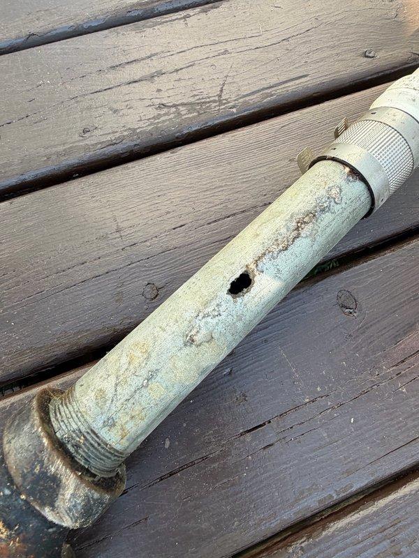Responded to emergency water leak affecting basement ceiling and lower unit. Upon arrival, identified source as kitchen sink drain line with galvanized pipe severely corroded and pitted in two locations. Water supply was shut off to prevent further damage. Removed deteriorated section of galvanized drain pipe and replaced with new piping. Tested system for proper drainage and verified leak was fully resolved with no additional water intrusion.