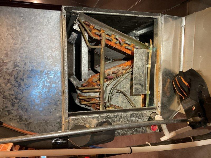 Performed AC maintenance on a 2018 Bryant furnace with a 2001 Bryant R-22 air conditioning system. Recorded operational parameters including return air dry bulb at 70.2°F, supply air at 56.5°F, outdoor dry bulb at 73°F, suction pressure at 64.7 psig, and liquid line pressure at 188 psig. After 15 minutes of runtime, indoor temperature split measured 13.7°F, indicating insufficient cooling performance and likely low refrigerant charge. Diagnostic readings suggest the R-22 system has experienced refrigerant loss, typically indicative of a leak or gradual charge depletion over time. No refrigerant service was performed as R-22 is no longer stocked due to phase-out regulations and limited availability. System remains operational but with reduced cooling capacity. Reviewed all diagnostic probe readings and performance data with homeowner, who elected to continue operating the unit as-is with plans to evaluate system replacement in spring unless complete failure occurs sooner.