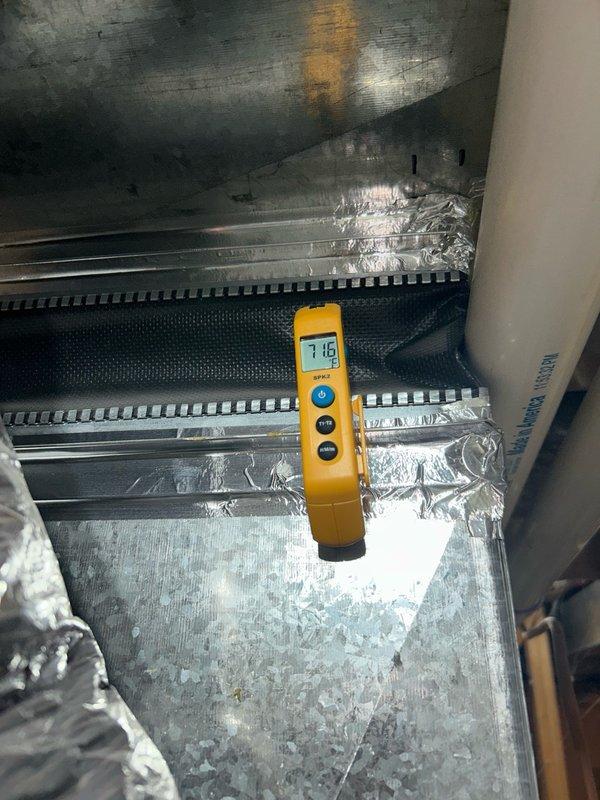 Responded to a no cooling complaint on a 4-year-old system. Upon arrival, inspected the indoor air handler and measured supply air temperature at 64.6°F, indicating inadequate cooling performance. Checked air filter condition and proceeded to outdoor unit inspection, where diagnostics revealed low refrigerant charge. Performed extended system runtime testing for 12 minutes baseline and an additional 13 minutes with charging jacket installed, with minimal change in operating parameters, confirming active refrigerant leak in the system.

Added proper weighed-in refrigerant charge to manufacturer specifications and injected UV dye into the system to facilitate future leak detection and pinpointing. Rechecked supply air temperature after refrigerant addition and verified proper system operation with supply air temperature dropping to 55.8°F, restoring adequate cooling capacity. System now operating within normal parameters. Advised that UV dye will require approximately one month to circul