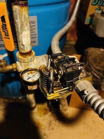 Responded to no water pressure complaint on residential well system. Upon diagnosis, identified multiple failing components including a faulty pressure switch, plugged nipple, defective pressure gauge, and bad circuit breaker preventing proper pump operation. Replaced pressure switch, gauge, and connecting nipple to restore proper system function. Addressed electrical issue by replacing the faulty breaker. Verified voltage and circuit integrity throughout troubleshooting process. System restored to proper operating pressure and functionality.