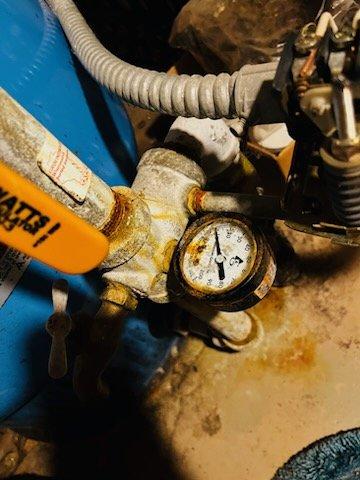 Responded to no water pressure complaint on residential well system. Upon diagnosis, identified multiple failing components including a faulty pressure switch, plugged nipple, defective pressure gauge, and bad circuit breaker preventing proper pump operation. Replaced pressure switch, gauge, and connecting nipple to restore proper system function. Addressed electrical issue by replacing the faulty breaker. Verified voltage and circuit integrity throughout troubleshooting process. System restored to proper operating pressure and functionality.