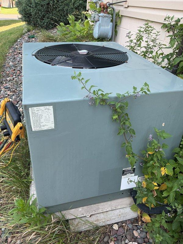 Responded to no cooling complaint on 16-year-old residential air conditioning system. Upon inspection, found failed dual run capacitor and heavily soiled outdoor condenser coil with significant dirt and debris accumulation restricting airflow. Replaced failed capacitor with proper rated replacement and performed thorough coil cleaning to restore heat transfer efficiency. Noted contactor showing wear with buzzing operation and pitted contacts, recommended for future replacement but currently functional. Performed complete system evaluation including refrigerant charge verification, amperage draws, temperature differentials, and operational testing of all components. All measurements within manufacturer specifications. System restored to full cooling operation with proper airflow and refrigerant levels confirmed.