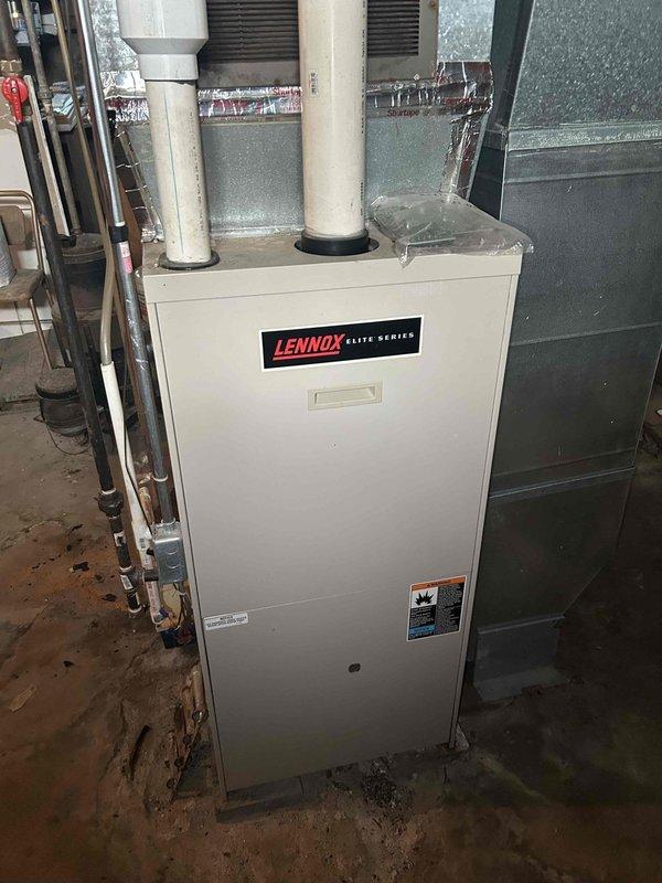 Responded to no cooling call on 10+ year old Lennox Elite Series system. Upon arrival, confirmed breaker was tripping immediately upon AC startup after unit had previously frozen up. Performed diagnostic testing and determined compressor was electrically grounded, causing overcurrent condition and breaker trip. Documented equipment condition with photos showing Lennox furnace and FlexZone control panel. Advised system requires compressor replacement or full outdoor unit replacement due to age and failure type.
