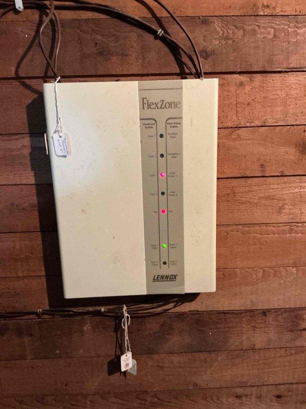 Responded to no cooling call on 10+ year old Lennox Elite Series system. Upon arrival, confirmed breaker was tripping immediately upon AC startup after unit had previously frozen up. Performed diagnostic testing and determined compressor was electrically grounded, causing overcurrent condition and breaker trip. Documented equipment condition with photos showing Lennox furnace and FlexZone control panel. Advised system requires compressor replacement or full outdoor unit replacement due to age and failure type.