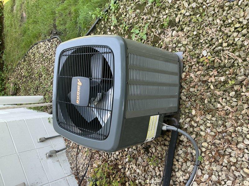 Responded to no cooling complaint on Amana air conditioning system installed four years ago. Upon arrival, confirmed outdoor fan was running but unit not producing cool air. Inspected attic-mounted air handler and found it in acceptable condition. Replaced dirty air filter and proceeded to outdoor condenser unit for further diagnostics.

Discovered condenser coils heavily clogged with cottonwood debris restricting airflow. Tested dual-run capacitor and found it reading 10/5 MFD against rated specification of 45/5 MFD, indicating significant capacitor degradation affecting compressor and fan motor operation. Advised customer of findings and recommended capacitor replacement and system cleaning to restore cooling function.

Replaced failed dual-run capacitor with proper 45/5 MFD rated component. Thoroughly cleaned condenser coils to remove cottonwood accumulation and restore proper heat exchange. Performed complete system tune-up including all electrical connections and component inspect