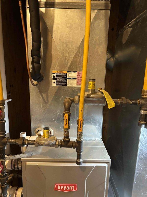 Completed annual cooling maintenance on single-zone residential AC system with 410A refrigerant at 81°F ambient temperature. Performed comprehensive inspection of Bryant indoor air handler including filter, condensate drain, blower motor, electrical wiring, and components—all found satisfactory. Verified proper temperature split across evaporator coil. Inspected outdoor condenser unit including coil cleanliness, capacitor condition, and measured amp draw on compressor, fan motor, and contactor—all within specifications. Verified refrigerant charge at proper operating levels.

Replaced failed dual-run capacitor (45+7.5 MFD) as system component had degraded beyond acceptable parameters. Replaced water panel humidifier pad and water filter per homeowner request to maintain optimal indoor air quality and humidification performance.

Addressed homeowner concern regarding blue discoloration observed on copper refrigerant lines, indicating potential oxidation or chemical reaction with insulat