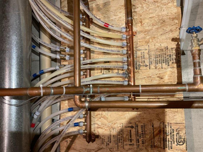 Performed comprehensive A/C maintenance evaluation on a 2004 home with original Nordyne air conditioning unit and 2020 Goodman single-stage 100,000 BTU furnace with ECM blower serving a two-zone system. Inspection revealed system in poor overall condition with multiple critical issues requiring immediate attention. Discovered active condensate leak from evaporator coil running down the back of the furnace. Upon removal of evaporator front cover, found delta plate and drain pan area visibly rusted through, indicating prolonged moisture exposure and structural deterioration. 

Conducted thorough furnace safety inspection which identified heat exchanger overheating at the back header, a serious safety concern. Noted improper equipment matching between single-stage furnace and two-zone system configuration, creating operational inefficiency and accelerated equipment wear. This mismatch poses ongoing concerns for long-term reliability and safe operation of the heating system.

Documented al