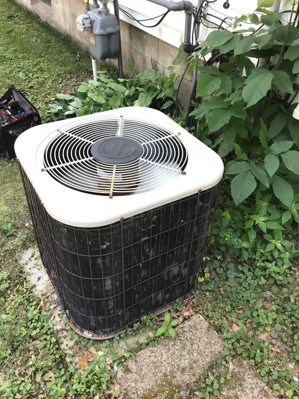 Responded to no cooling complaint on 15-year-old residential air conditioning system. Upon arrival, found outdoor condenser fan motor operating but compressor not running. Performed diagnostic testing on dual run capacitor and determined hermetic (compressor) side had failed with zero microfarad reading. Replaced failed capacitor with new unit to manufacturer specifications. Cycled system through complete operation and verified both condenser fan motor and compressor engaging properly. System restored to normal cooling operation.