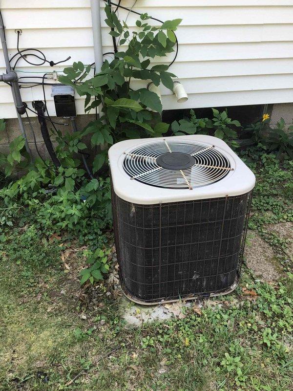 Responded to no cooling complaint on 15-year-old residential air conditioning system. Upon arrival, found outdoor condenser fan motor operating but compressor not running. Performed diagnostic testing on dual run capacitor and determined hermetic (compressor) side had failed with zero microfarad reading. Replaced failed capacitor with new unit to manufacturer specifications. Cycled system through complete operation and verified both condenser fan motor and compressor engaging properly. System restored to normal cooling operation.