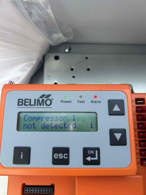 Responded to no cooling call for commercial building with multiple RTU failures. Northwest rooftop unit was tripped on high head pressure; reset unit and rinsed condenser coils on both westside units with water, restoring operation. Kitchen RTU compressor #1 found completely flat on refrigerant charge with evidence of previous refrigerant fills and dye testing. Located significant oil accumulation at TXV suction line connection point indicating cracked fitting and active refrigerant leak. Documented findings and submitted part order form for leak repair quote.