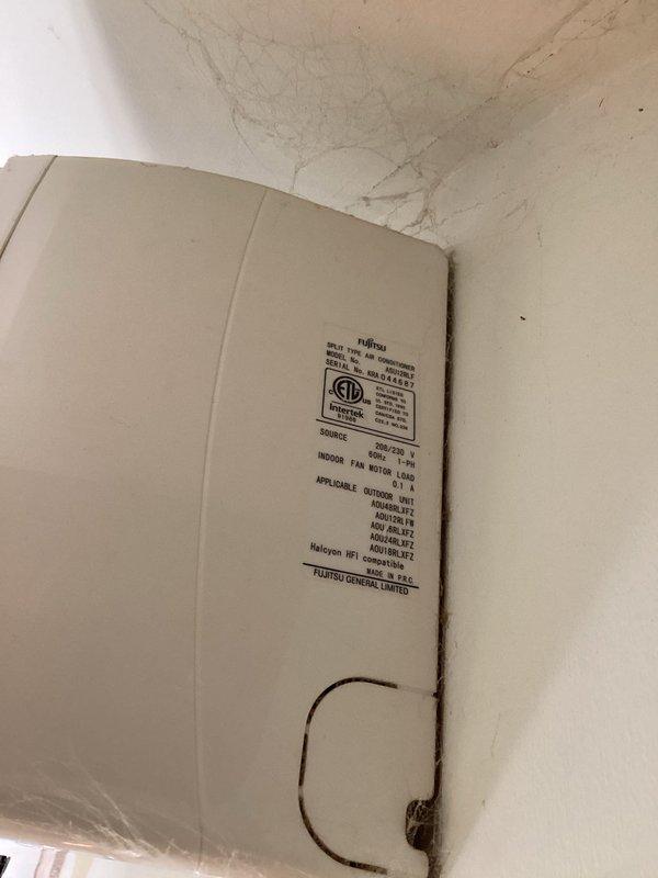 Responded to no cooling complaint on 10+ year old Fujitsu mini split system. Unit was not powering on and displayed 6 flashes at LED3 indicator. Consulted with technical support to diagnose the fault code and determined two thermistors in head unit C had failed, preventing system operation. Documented findings with photos of the indoor air handler unit and manufacturer label information. Parts department will provide estimate for replacement thermistors, and service call has been rescheduled to complete repairs once components are available.