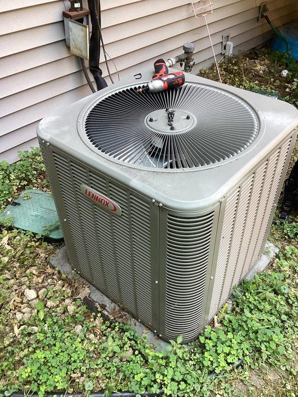 Responded to no cooling complaint on 9-year-old Lennox 14ACX system. Performed diagnostic evaluation and determined compressor failure as primary cause of no cooling condition. Identified possible refrigerant system restriction requiring further investigation. Verified unit is covered under existing parts warranty from original installing contractor. Documented system conditions with photographs showing outdoor condensing unit and component access points. Due to age of equipment and extent of required repairs, provided customer with options including warranty repair with associated labor and replacement system alternative at discounted pricing. Initiated warranty claim processing for failed compressor component.