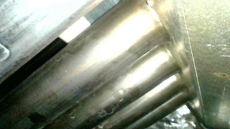 Responded to warranty call for recently installed furnace producing ticking noise during blower operation. Removed evaporator coil to inspect for loose components but found no issues. Upon further investigation using fish camera, identified heat exchanger rattling as source of noise. Inspected heat exchanger thoroughly for cracks or structural compromises but found none. Presented options for heat exchanger replacement or full furnace replacement, but homeowner elected to monitor the condition and continue operation as-is since no safety concerns were detected.