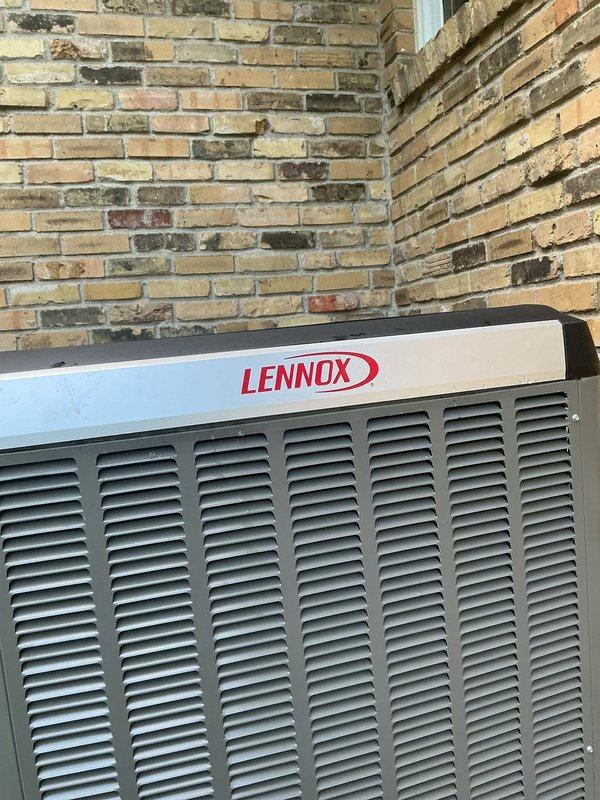 Responded to warranty call for Lennox heat pump unit that was off-level and had loose rattling manufacturer decal. Coordinated two-technician team to properly level and recenter the outdoor condenser unit using appropriate leveling techniques. Secured manufacturer branding decal to unit housing to prevent further detachment and rattling noise during operation.