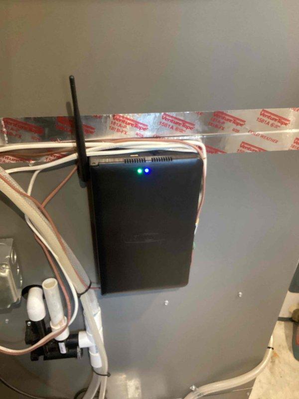 Responded to ongoing thermostat communication issues with smart hub requiring repeated breaker resets to restore functionality. Documented existing S40 smart hub installation with photos showing wireless connectivity device mounted to HVAC panel with active LED indicators and external antenna. Submitted parts order for replacement S40 unit due to persistent connection failures affecting system operation.