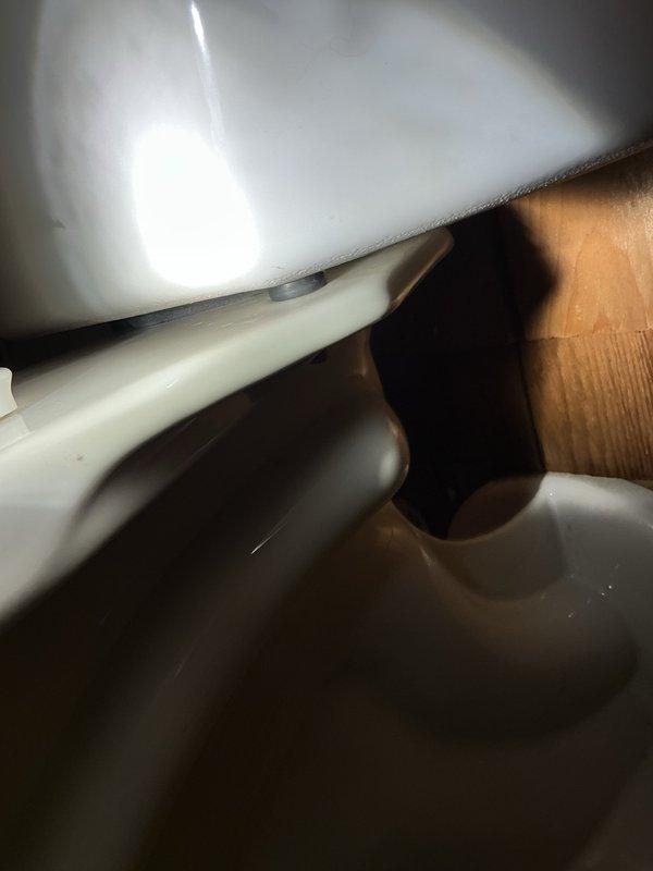 Replaced defective tank-to-bowl gasket on toilet to resolve leak issue. Installed new gasket, reassembled tank components, and conducted fifteen flush tests to verify proper seal with no leakage detected. During inspection, identified minor drip on basement ceiling shower originating from drain above; informed homeowner for monitoring and potential future service.