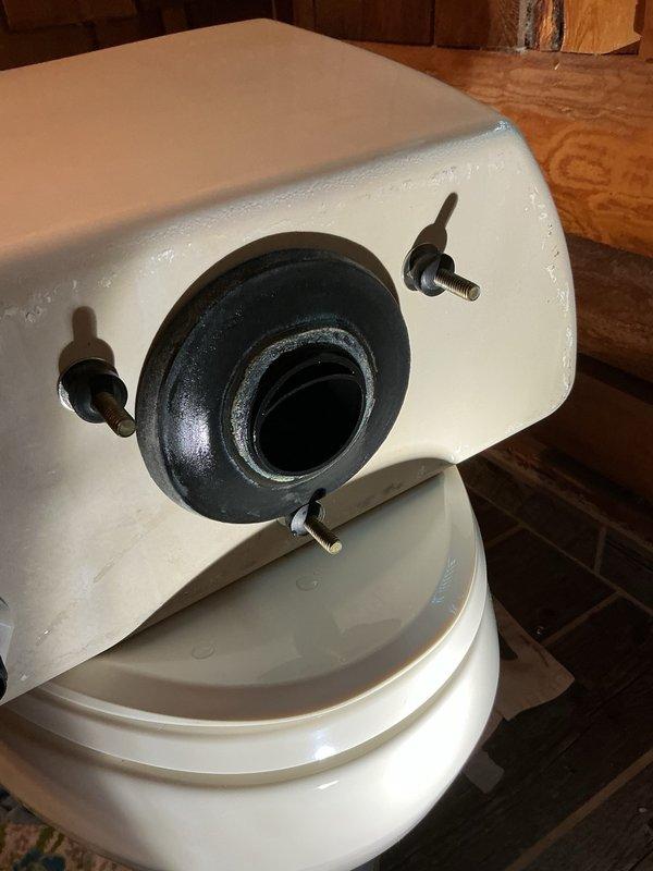 Replaced defective tank-to-bowl gasket on toilet to resolve leak issue. Installed new gasket, reassembled tank components, and conducted fifteen flush tests to verify proper seal with no leakage detected. During inspection, identified minor drip on basement ceiling shower originating from drain above; informed homeowner for monitoring and potential future service.