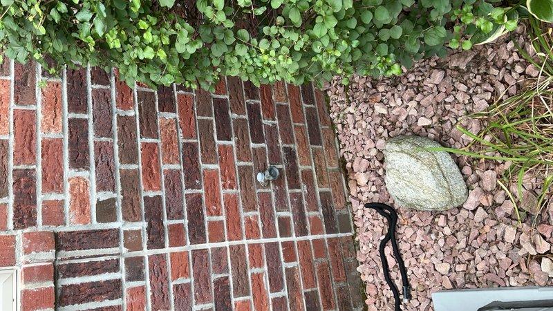 Responded to service call for leaking outdoor spigot. Upon arrival, inspected the exterior hose bibb at the base of the brick structure and assessed the condition of the fixture and surrounding area. Provided detailed estimate for complete hose bibb replacement and installation to resolve the leak issue and restore proper function to the outdoor water supply.