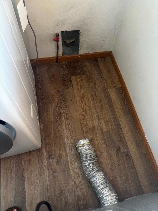 Responded to service call for detached dryer vent in utility closet. Found flexible duct completely disconnected from exterior wall termination point due to inadequate mounting lip on exterior vent opening. Installed new dryer vent termination with proper mounting flange to secure flexible ductwork connection. Reattached flexible dryer vent duct to new termination point, ensuring proper seal and support. Performed operational test of dryer unit to verify adequate airflow and proper venting function. System operating correctly with no restrictions.