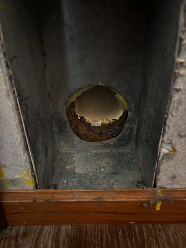Responded to service call for detached dryer vent in utility closet. Found flexible duct completely disconnected from exterior wall termination point due to inadequate mounting lip on exterior vent opening. Installed new dryer vent termination with proper mounting flange to secure flexible ductwork connection. Reattached flexible dryer vent duct to new termination point, ensuring proper seal and support. Performed operational test of dryer unit to verify adequate airflow and proper venting function. System operating correctly with no restrictions.