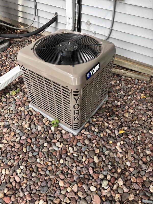 Completed preventive maintenance on York brand central air conditioning system. Performed condenser coil cleaning, verified all electrical components operating within manufacturer specifications, and confirmed system running and cooling properly. Unit tested and left in good working order.