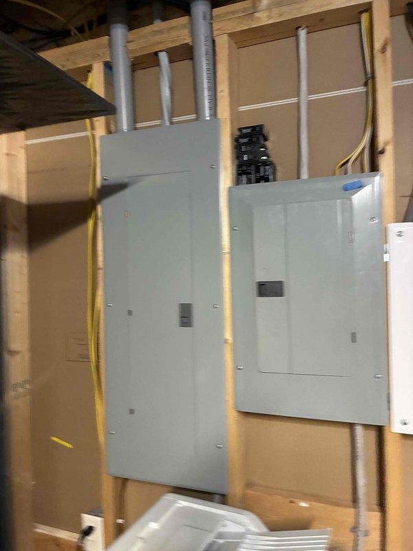 Performed preventive maintenance on 9-10 year old central air conditioning system located on ground floor exterior. Upon initial diagnostics, measured 34° superheat indicating low refrigerant charge. Connected manifold gauges and identified system was low on refrigerant, with history of previous refrigerant additions. Located yellow UV dye streak on evaporator coil confirming active refrigerant leak at indoor coil.

Attempted refrigerant charge adjustment but encountered challenging conditions with 30 mph winds and 55° ambient temperature affecting microchannel condenser performance. TXV exhibited hunting behavior throughout service, causing subcooling to fluctuate between 4-8° during charging process. Performed condenser coil cleaning, but TXV hunting worsened after washing. Added refrigerant to system but unable to achieve optimal charge due to adverse weather conditions and TXV instability.

Conducted thorough leak detection inspection using UV light on evaporator coil and refrigera