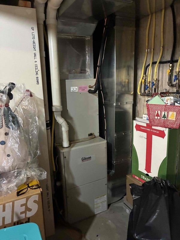 Performed preventive maintenance on 9-10 year old central air conditioning system located on ground floor exterior. Upon initial diagnostics, measured 34° superheat indicating low refrigerant charge. Connected manifold gauges and identified system was low on refrigerant, with history of previous refrigerant additions. Located yellow UV dye streak on evaporator coil confirming active refrigerant leak at indoor coil.

Attempted refrigerant charge adjustment but encountered challenging conditions with 30 mph winds and 55° ambient temperature affecting microchannel condenser performance. TXV exhibited hunting behavior throughout service, causing subcooling to fluctuate between 4-8° during charging process. Performed condenser coil cleaning, but TXV hunting worsened after washing. Added refrigerant to system but unable to achieve optimal charge due to adverse weather conditions and TXV instability.

Conducted thorough leak detection inspection using UV light on evaporator coil and refrigera