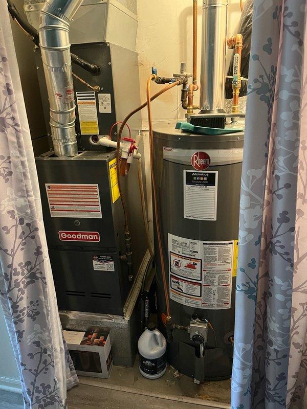 Completed preventive maintenance tune-up on a 7-year-old Goodman central air conditioning system originally installed in 2018. Performed comprehensive AC inspection including filter replacement with 14x20x1 filter, verified evaporator coil was clean with proper drainage, conducted electrical testing with all readings within manufacturer specifications, cleaned outdoor condenser unit, and ran system through full operational cycle for 15 minutes confirming proper performance with temperature split exceeding 17 degrees across the coil. All components functioning properly with no deficiencies noted.