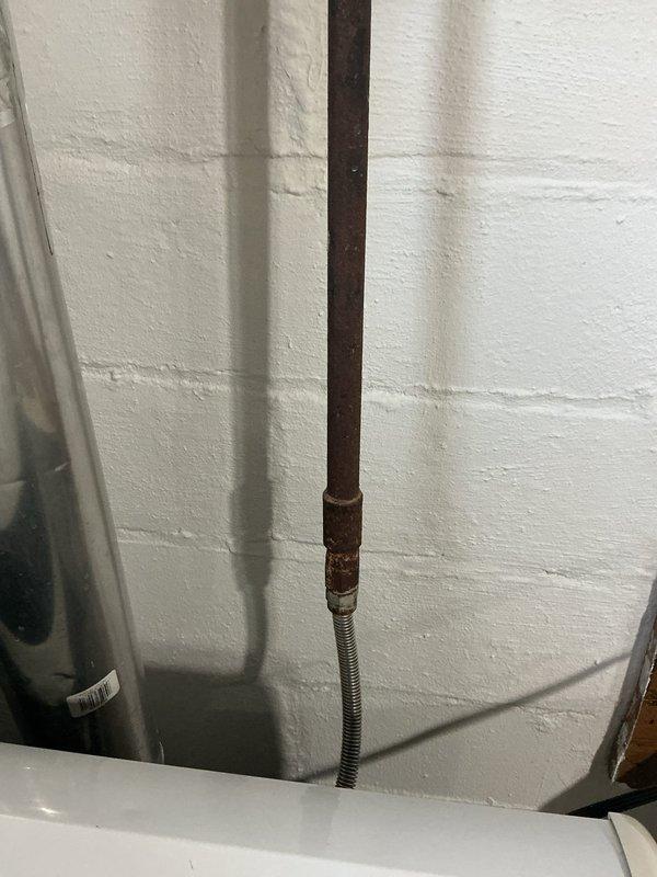 Responded to service call at vacant property to assess gas line condition. Upon inspection, found approximately 4 feet of corroded gas piping requiring replacement. No active gas leak detected at time of service. Documented existing conditions with photographs showing significant rust and corrosion on vertical gas line with flexible connector. Prepared estimate for gas line replacement and submitted parts requisition form for pricing approval.