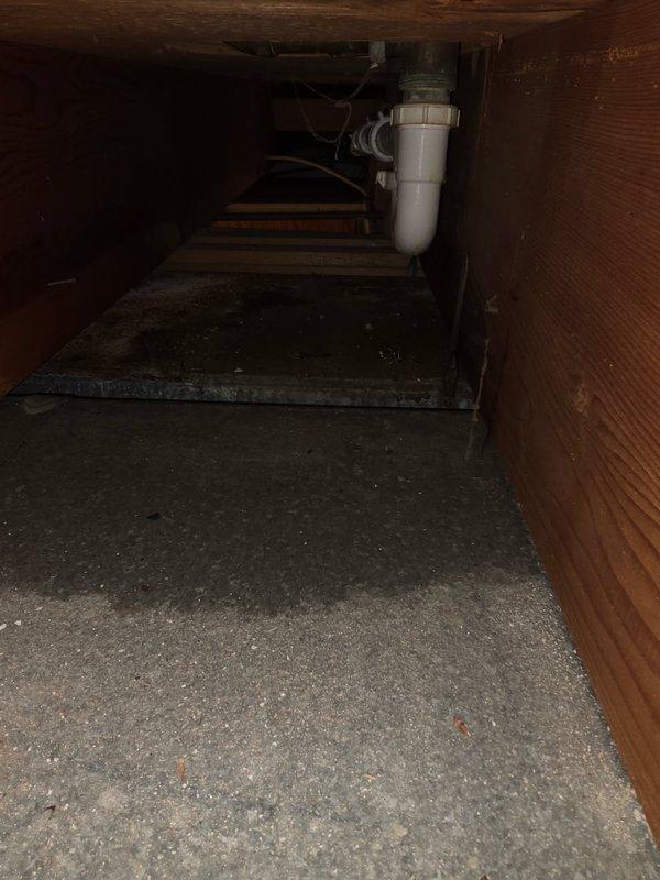 Responded to a tub drain leak causing water damage to basement ceiling and ductwork below. Created wall access to diagnose the issue and discovered a deteriorated tub/shower valve and cracked drain assembly. Installed new Moen tub and shower valve along with complete tub waste and overflow replacement. Conducted pressure testing by filling tub and running showerhead to verify proper operation and confirm leak resolution. Noted existing rust damage on ductwork beneath repair area from prolonged water exposure, recommended separate HVAC assessment for affected components.
